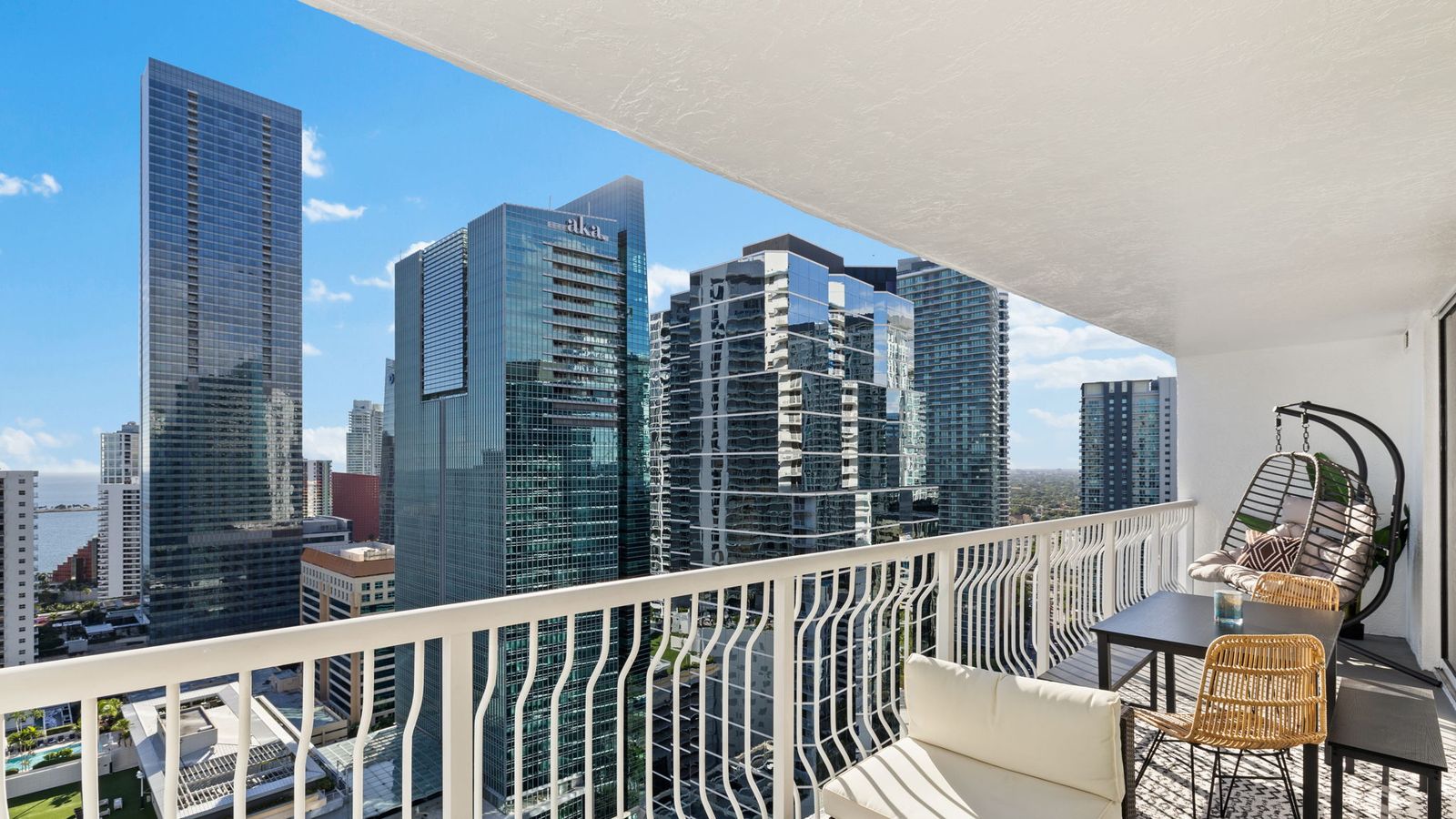 27-foot wraparound balcony with Biscayne Bay and the Brickell skyline beyond